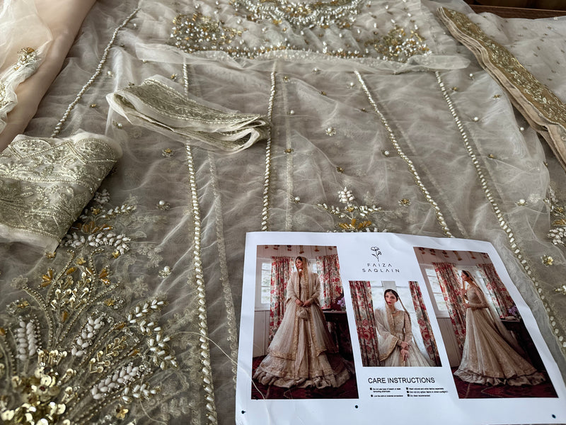 Faiza Saqlain golden white bridal wedding edition